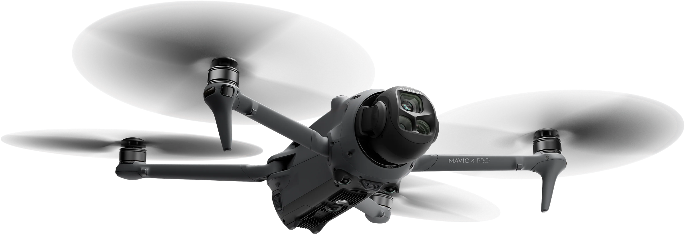 DJI Mavic 4 Pro drone in flight, seen from below at an angle